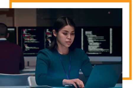 Cybersecurity consultant works on security requirements for urban data platforms at the computer