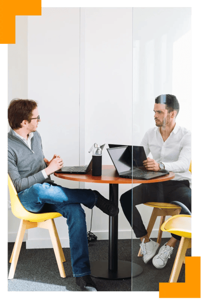 Security auditors discussing compliance requirements